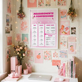 Pink educational math poster hanging on a gallery wall filled with pink aesthetic art prints and dried flowers.