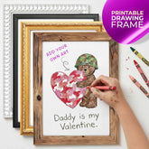 Framed drawing of a teddy bear holding a heart with 'Daddy is my Valentine' text, surrounded by crayons.