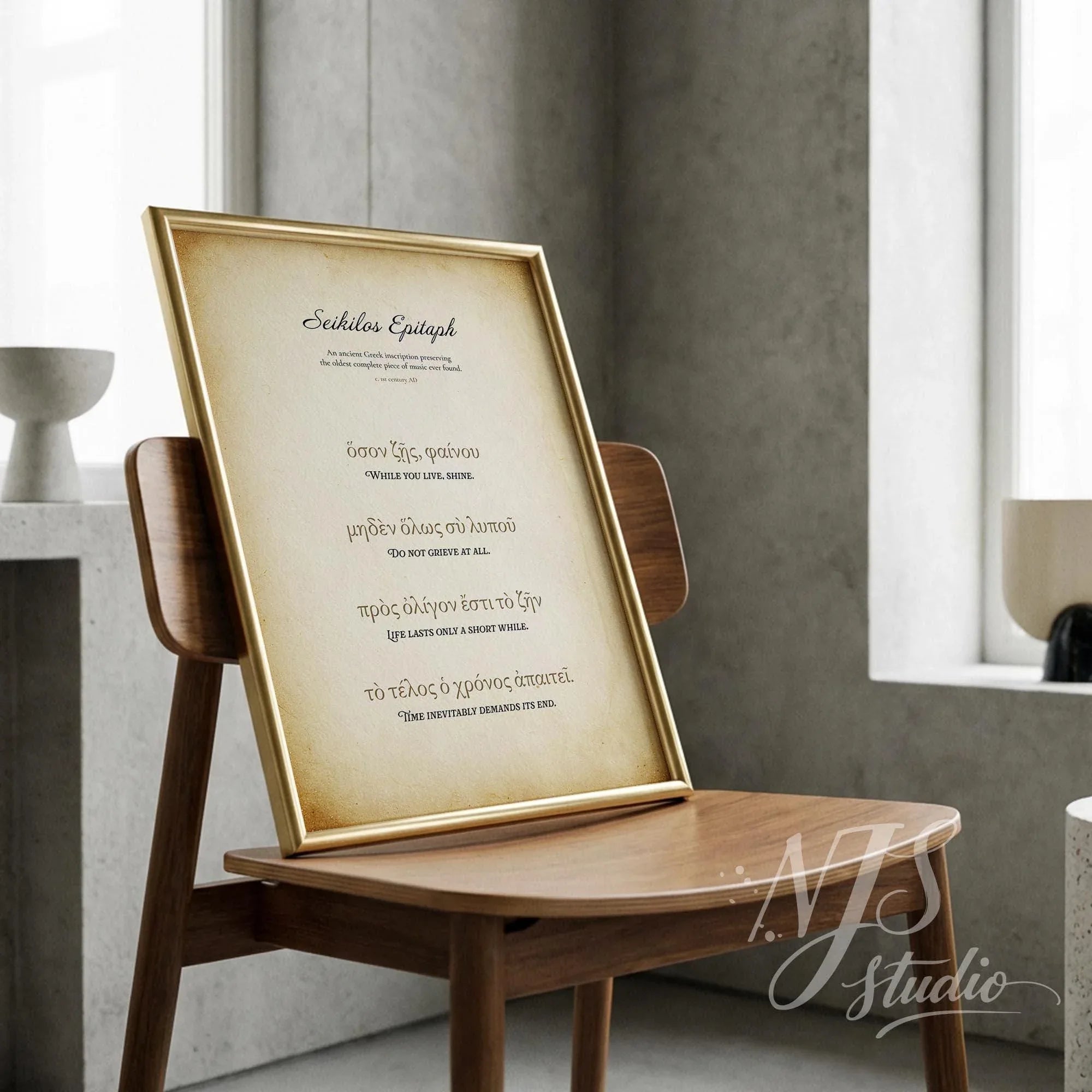 Elegant gold framed print on a wooden chair, featuring the oldest song lyrics from ancient Greece.