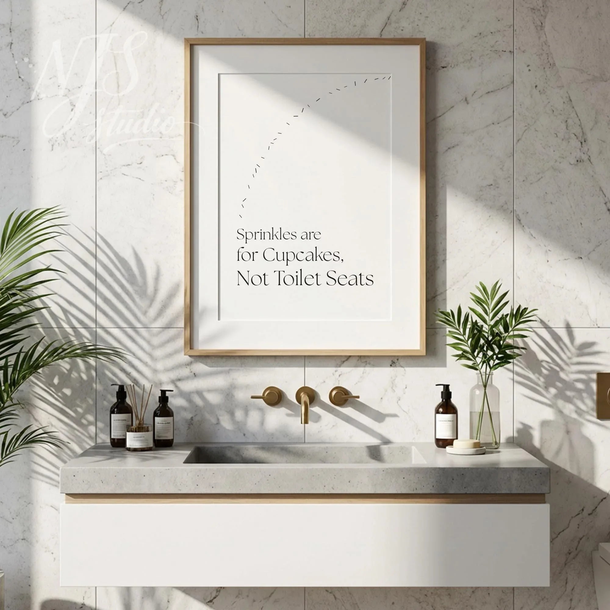 Humorous bathroom wall art displayed above a modern vanity with plants and soap bottles, creating a clean and playful look.