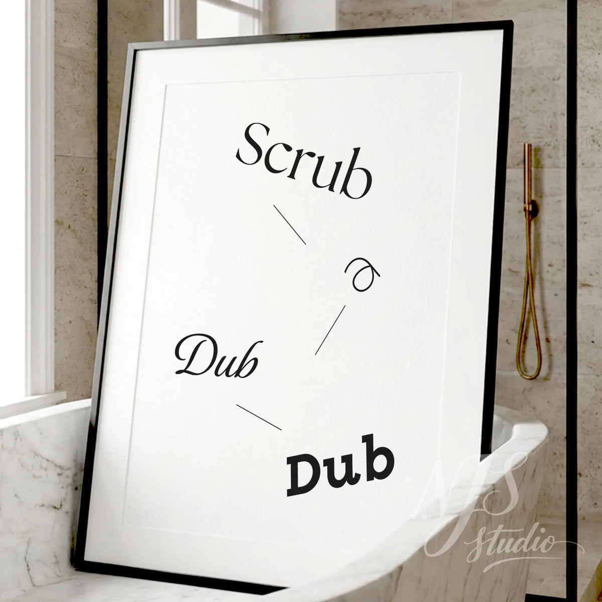 Minimal bathroom wall art featuring the phrase “Scrub a Dub Dub,” displayed in a black frame leaning on a marble bathroom counter.