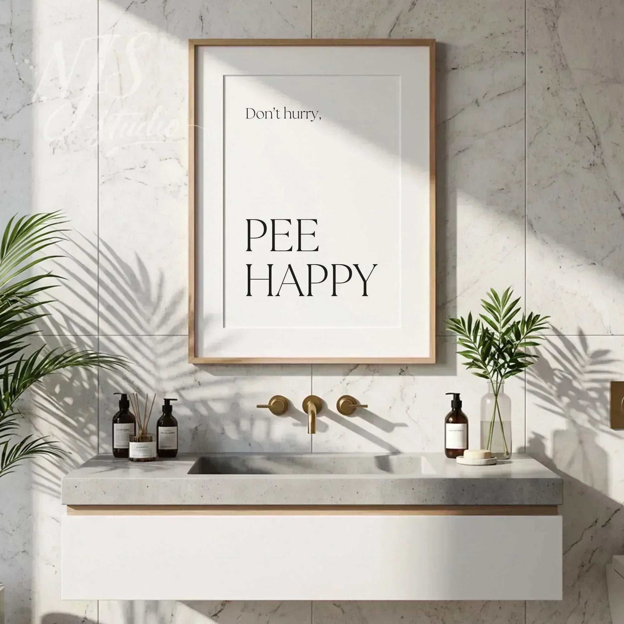 Funny bathroom quote wall art reading “Don’t hurry, Pee Happy,” styled above a modern vanity with plants and neutral decor.