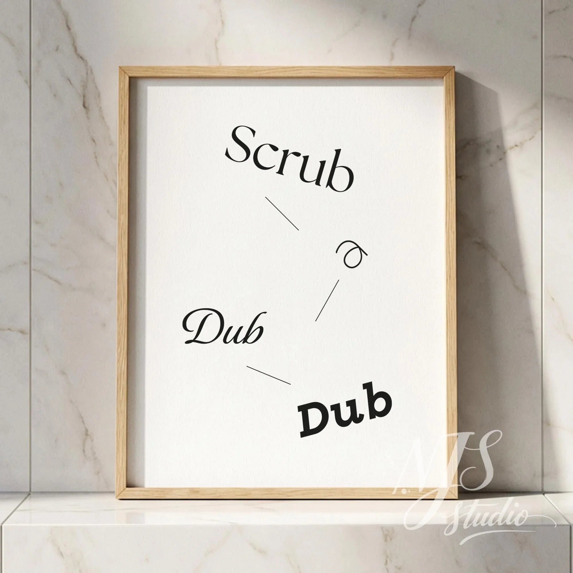 Minimal typography bathroom poster with the text “Scrub a Dub Dub,” framed in natural wood and styled against a marble tile wall.