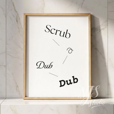 Minimal typography bathroom poster with the text “Scrub a Dub Dub,” framed in natural wood and styled against a marble tile wall.