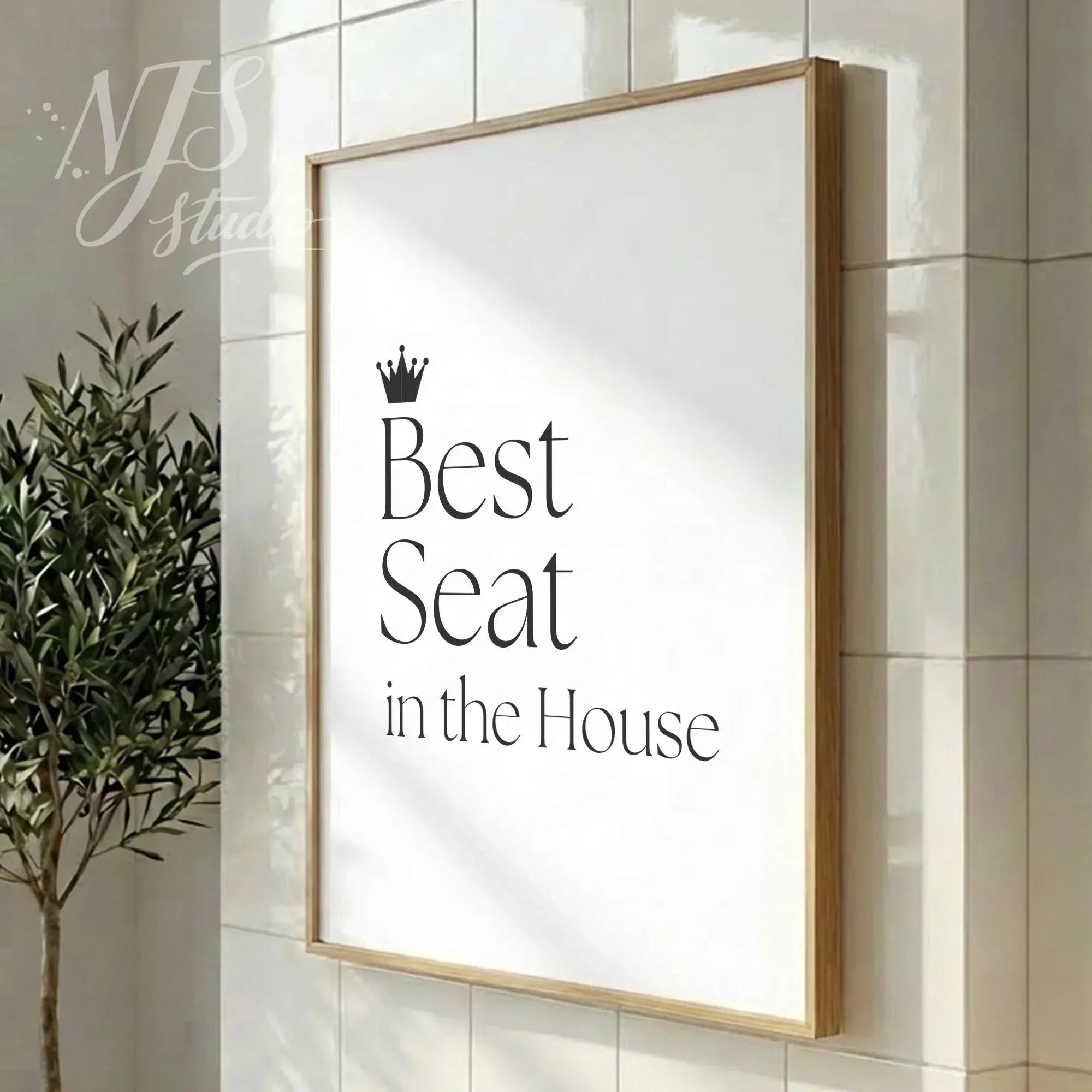 Modern bathroom poster with funny quote “Best Seat in the House,” minimalist wall decor with black serif typography in a contemporary bathroom setting.