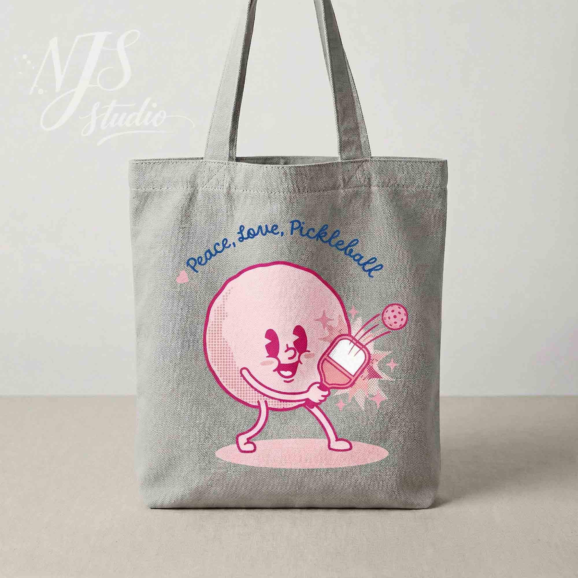 Canvas tote bag with cute pink pickleball character. "Peace Love Pickleball" SVG design for crafters and DIY gifts.
