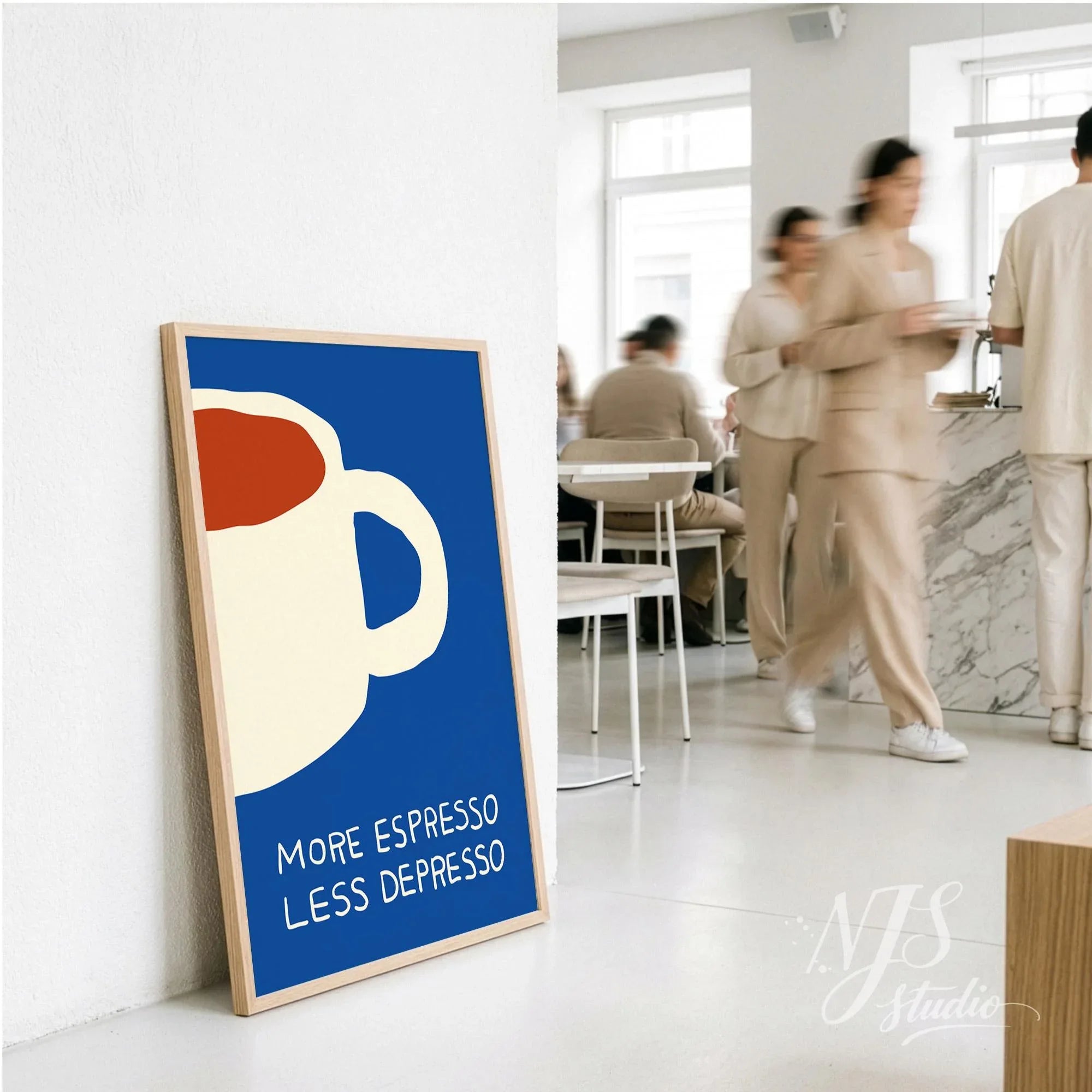 Large framed blue coffee poster leaning against a wall in a busy cafe setting with people walking by.