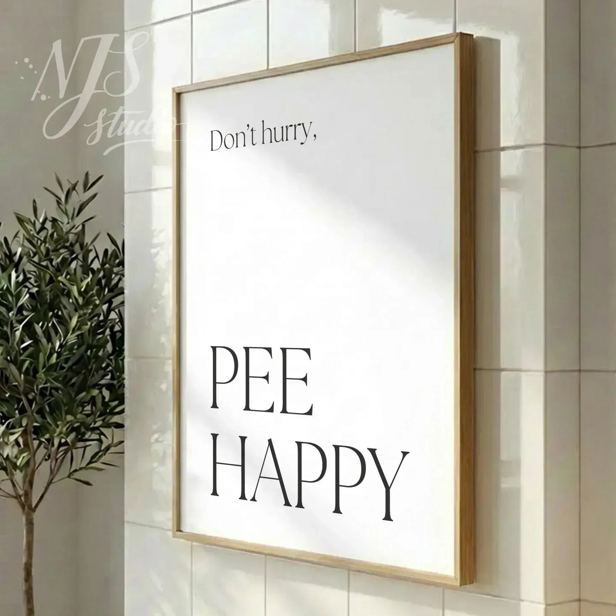 Modern bathroom poster featuring the phrase “Don’t hurry, Pee Happy,” displayed in a vertical wood frame in a clean interior.