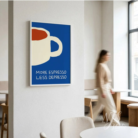 Minimalist blue espresso art print leaning on a sideboard next to coffee cups and a milk jug.