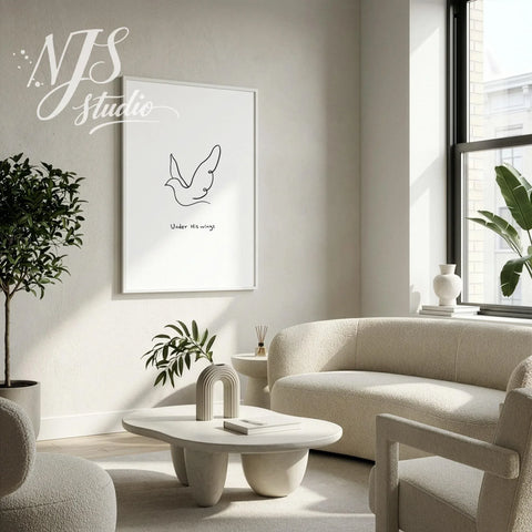 Large framed minimalist Christian wall art hanging in a neutral beige living room with a sofa.