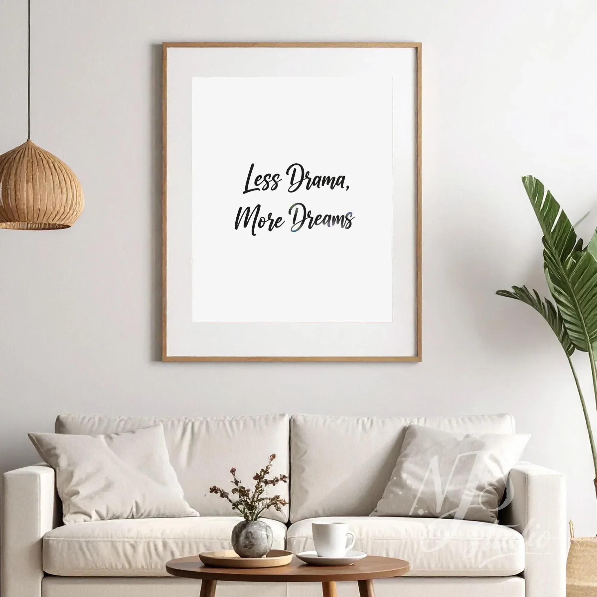 Large framed wall art hanging in a white living room with boho lighting, minimalist style.