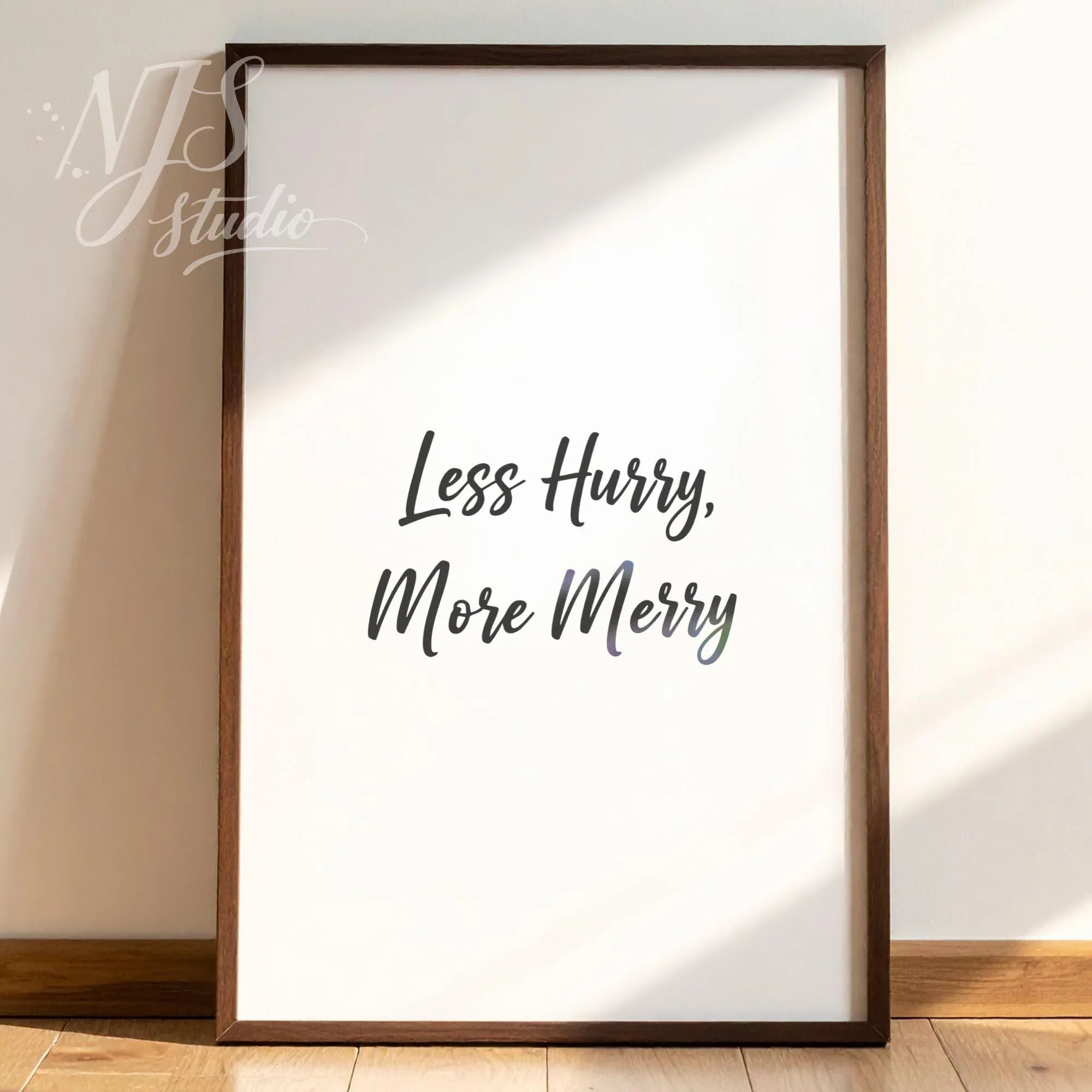 Wooden framed motivational print leaning against a textured wall with tree shadows, calming nature-inspired decor.