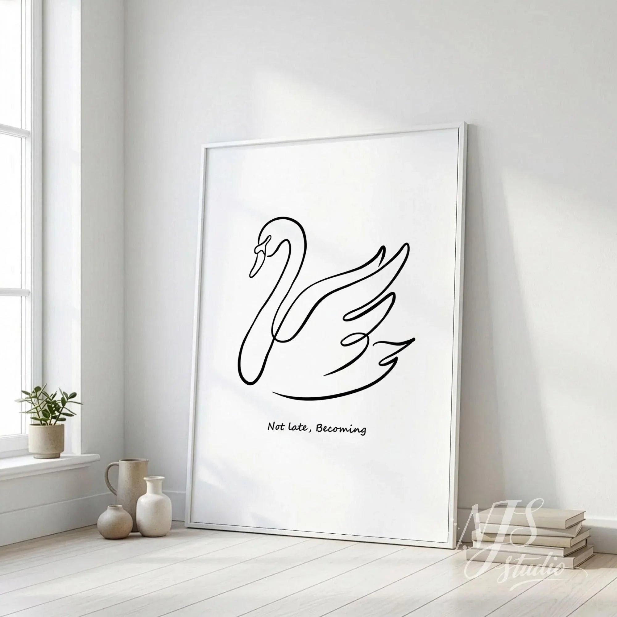 Large minimalist swan line drawing poster leaning on floor near window with vases and books, neutral modern interior wall art