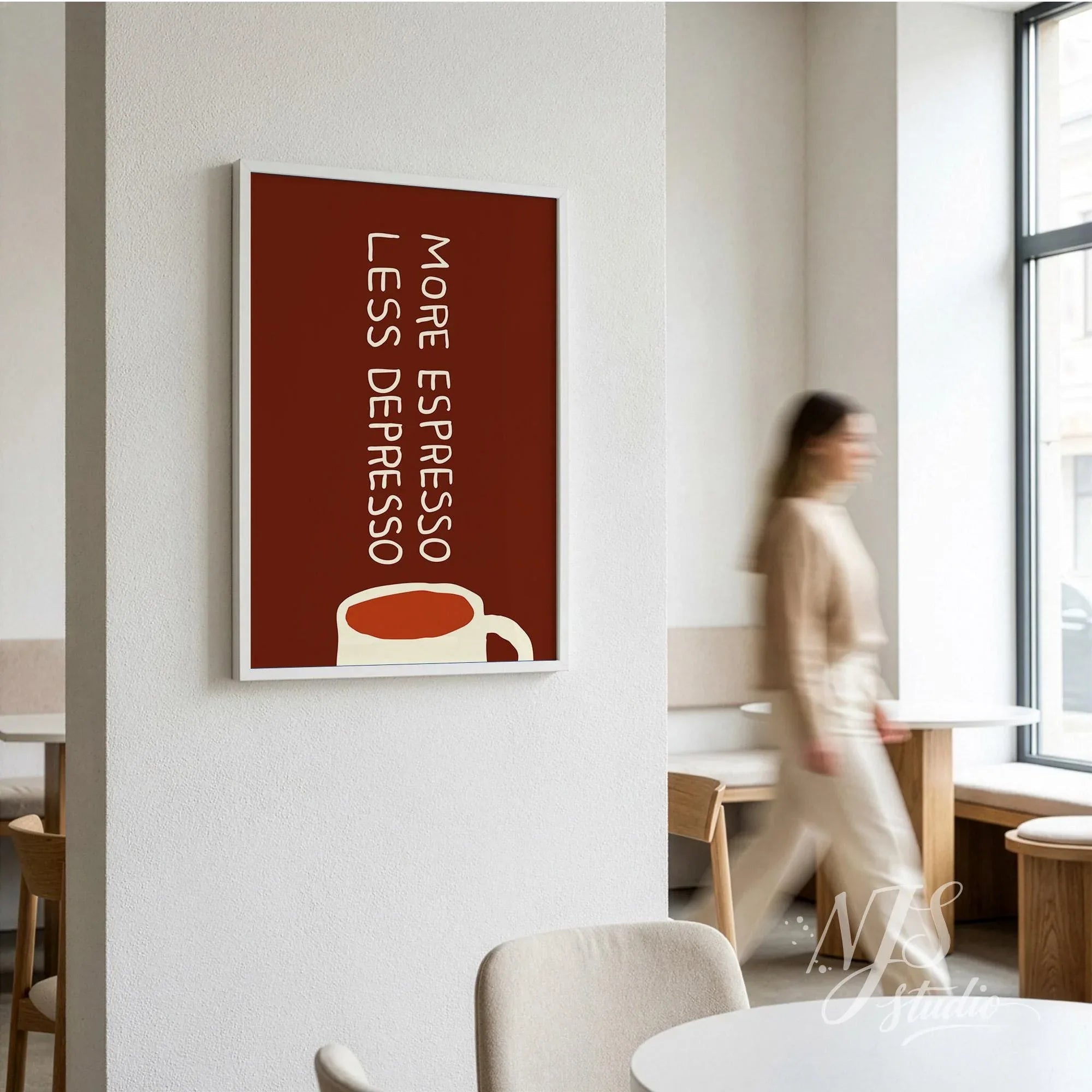 Vertical brown typography print saying More Espresso Less Depresso hanging in a modern coffee shop.