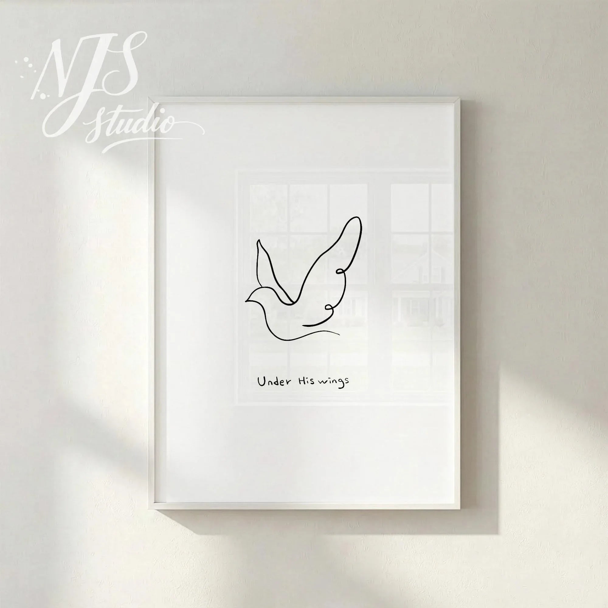 Minimal white framed line art bird illustration with “Under His Wings” text, styled on bright neutral wall for peaceful Christian home decor.