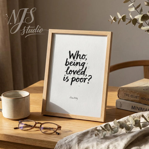 Minimalist wooden framed inspirational quote standing on a desk with glasses, brush font style.